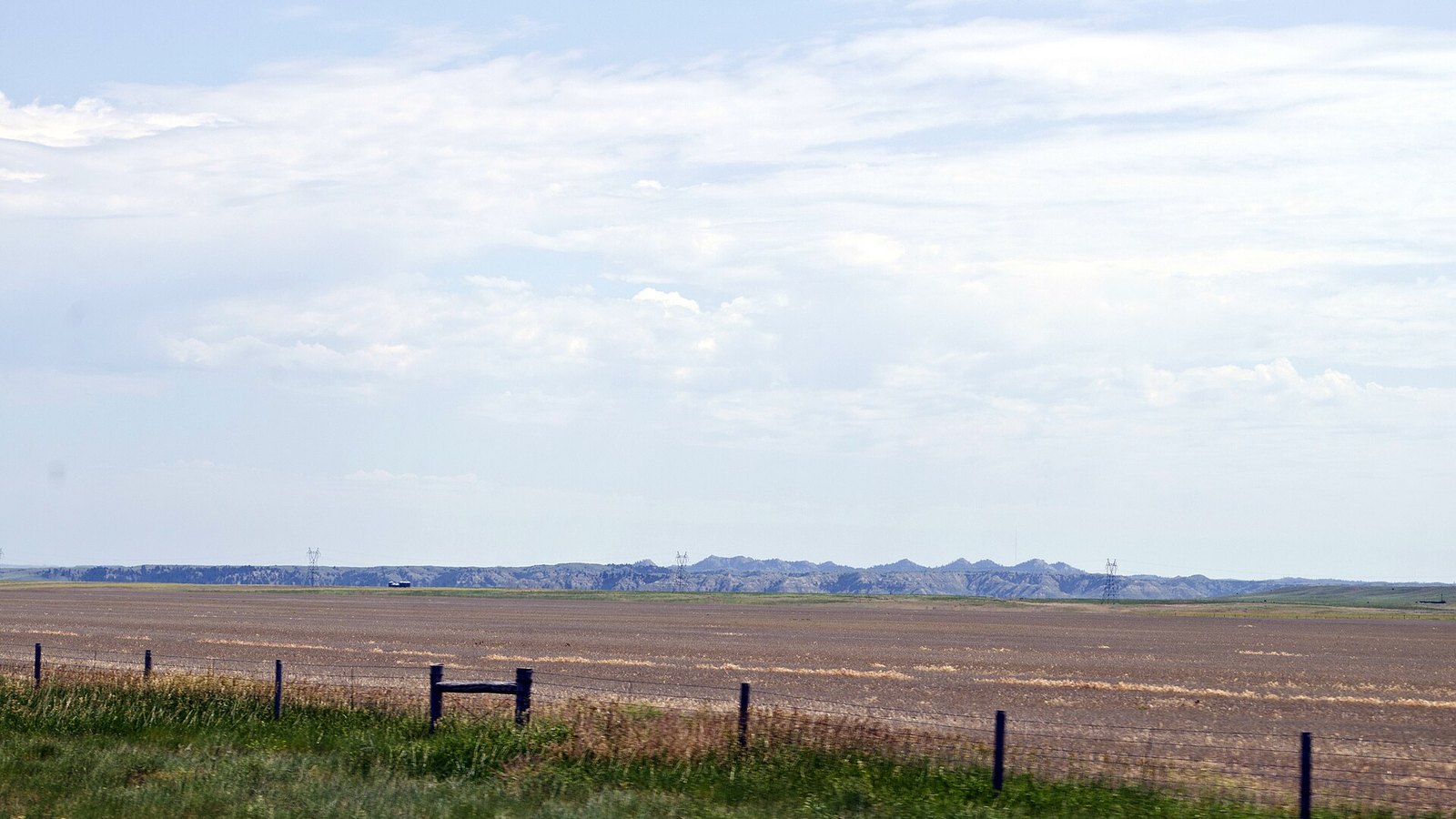Plowed wheat fields and the Sheep Mountains near Miles City, Montana